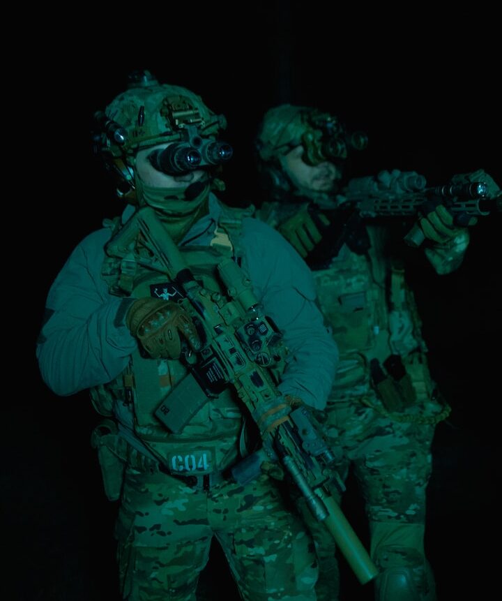 a couple of soldiers standing next to each other